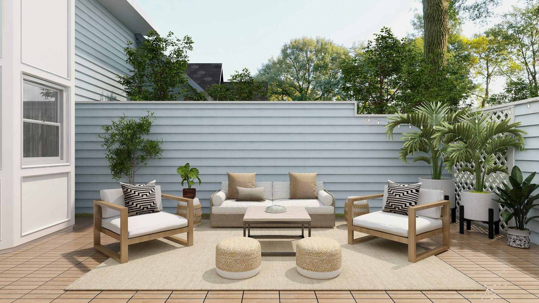 A light outdoor conversation set arranged on a backyard patio